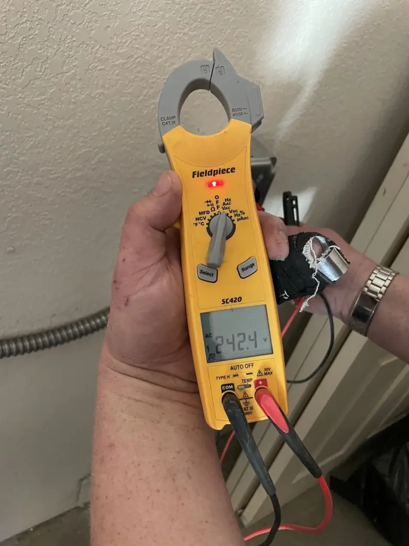 Voltage testing with clamp meter during Recessed Lighting Installation in Forks